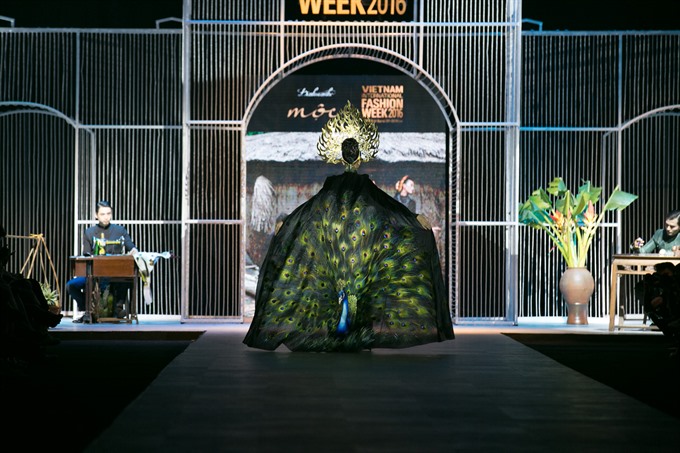 The collection was highlighted by the Truong Thi May 10-kilogramme headdress with an embroidered peacock cape.