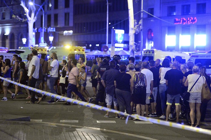13 dead in Barcelona van carnage, driver at large