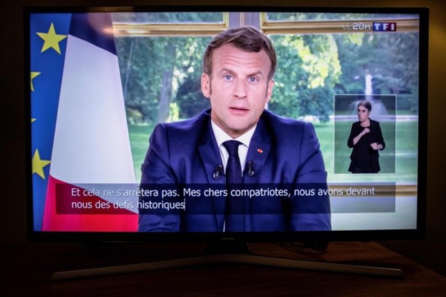 Macron says France has scored its first victory against virus

