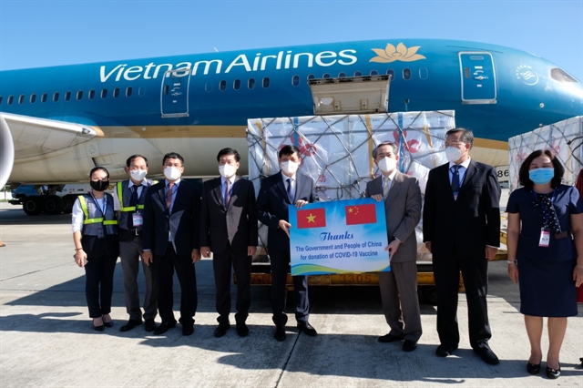 China-donated COVID-19 vaccines and syringes arrive at Nội Bài airport