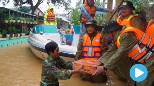 Heavy rain floods wreak havoc in central provinces as new typhoon approaches