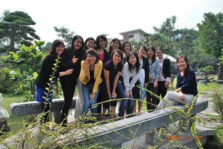 Fun and games: Dr Phan Thuy Chi (first from right, sitting) and her colleagues and students during a field trip. Fun and games: Dr Phan Thuy Chi (first from right, sitting) and her colleagues and students during a field trip.