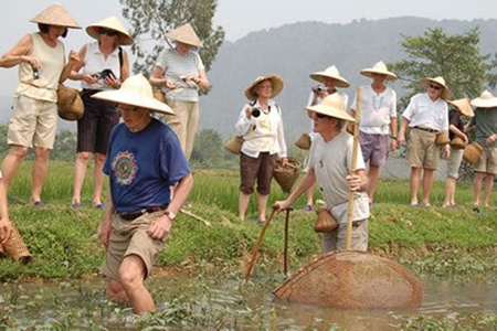 Grey nomad trail: Tourists enjoy outdoor activities during their homestay tour in Van Long District in Ninh Binh Province. Grey nomad trail: Tourists enjoy outdoor activities during their homestay tour in Van Long District in Ninh Binh Province.