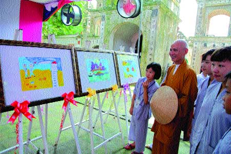 End of term show: Teacher monk Most Venerable Thich Thanh Phuong reviews the final artwork of the youths. End of term show: Teacher monk Most Venerable Thich Thanh Phuong reviews the final artwork of the youths.