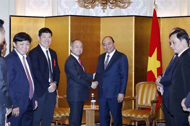 PM welcomes SoftBank’s investment in Việt Nam