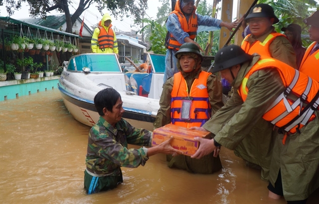 Heavy rain, floods wreak havoc in central provinces as new typhoon approaches