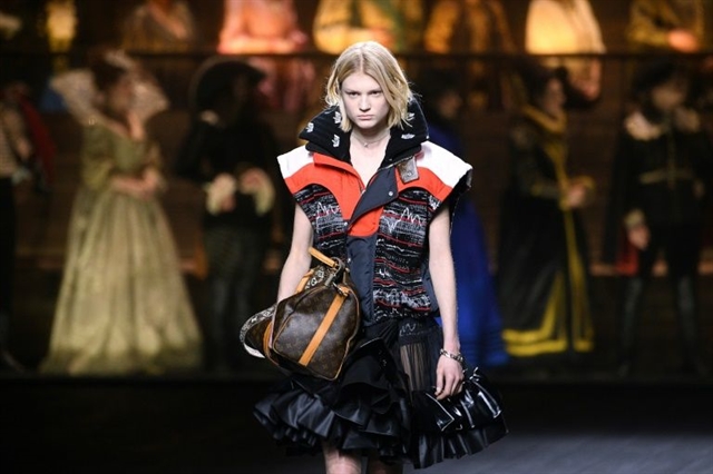Vuitton hits high note with all-singing Paris fashion show