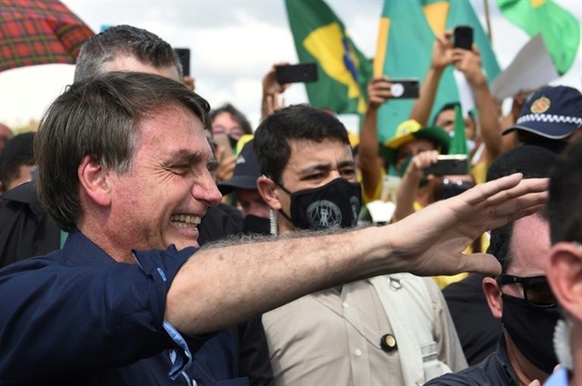 Bolsonaro rallies with supporters amid virus surge
