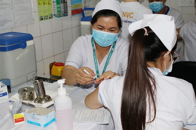 Việt Nam begins COVID-19 vaccination with 250 medical workers in HCM City, Hà Nội, Hải Dương