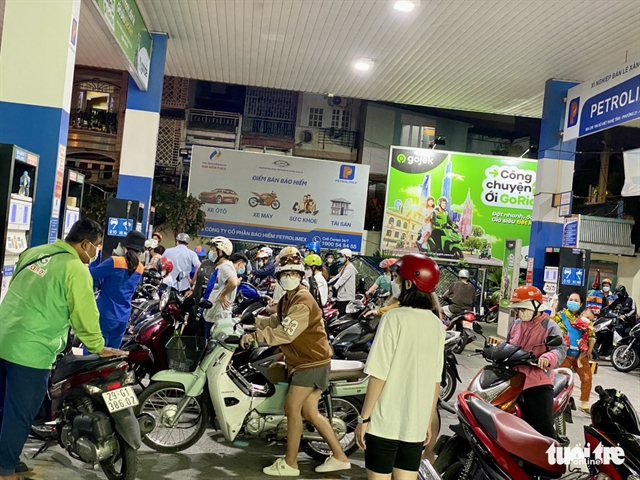 People flock to petrol stations in HCM City to beat price hike