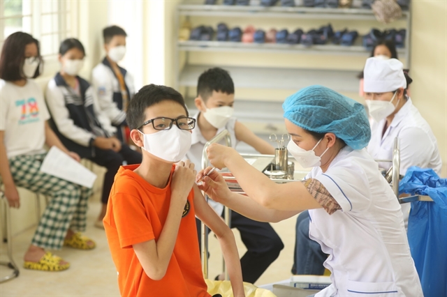 Children aged 5-11 in HN HCM City get first vaccine shot