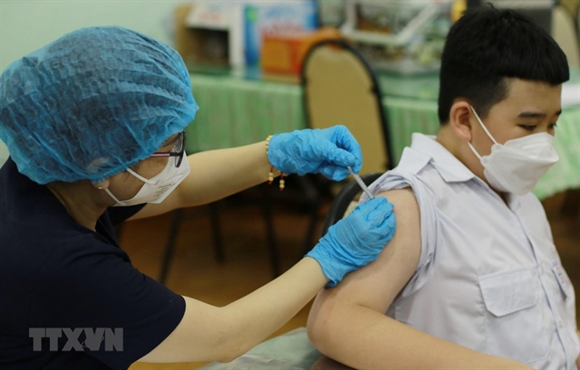 230000 HCM City kids get first COVID-19 vaccine shot