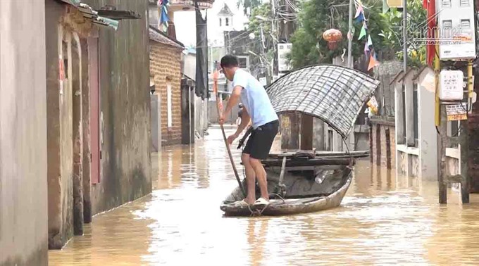 Floods wreak havoc on Hà Nội suburbs