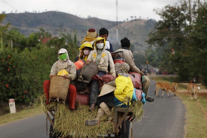A three-wheel vehicle carries farmers to the fields in the Central Highland province of Đắk Lắk. — VNA/VNS Photo Dương Giang